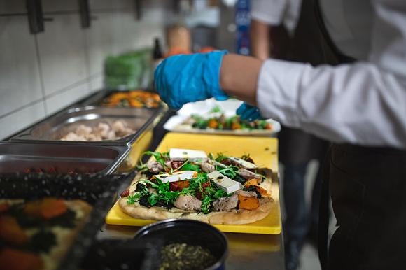 cook preparing meal in kitchen
